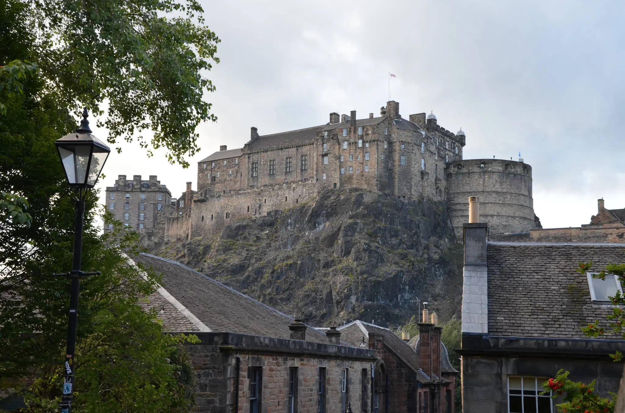 Edinburgh Castle on a cloudy day with historic buildings and lamppost