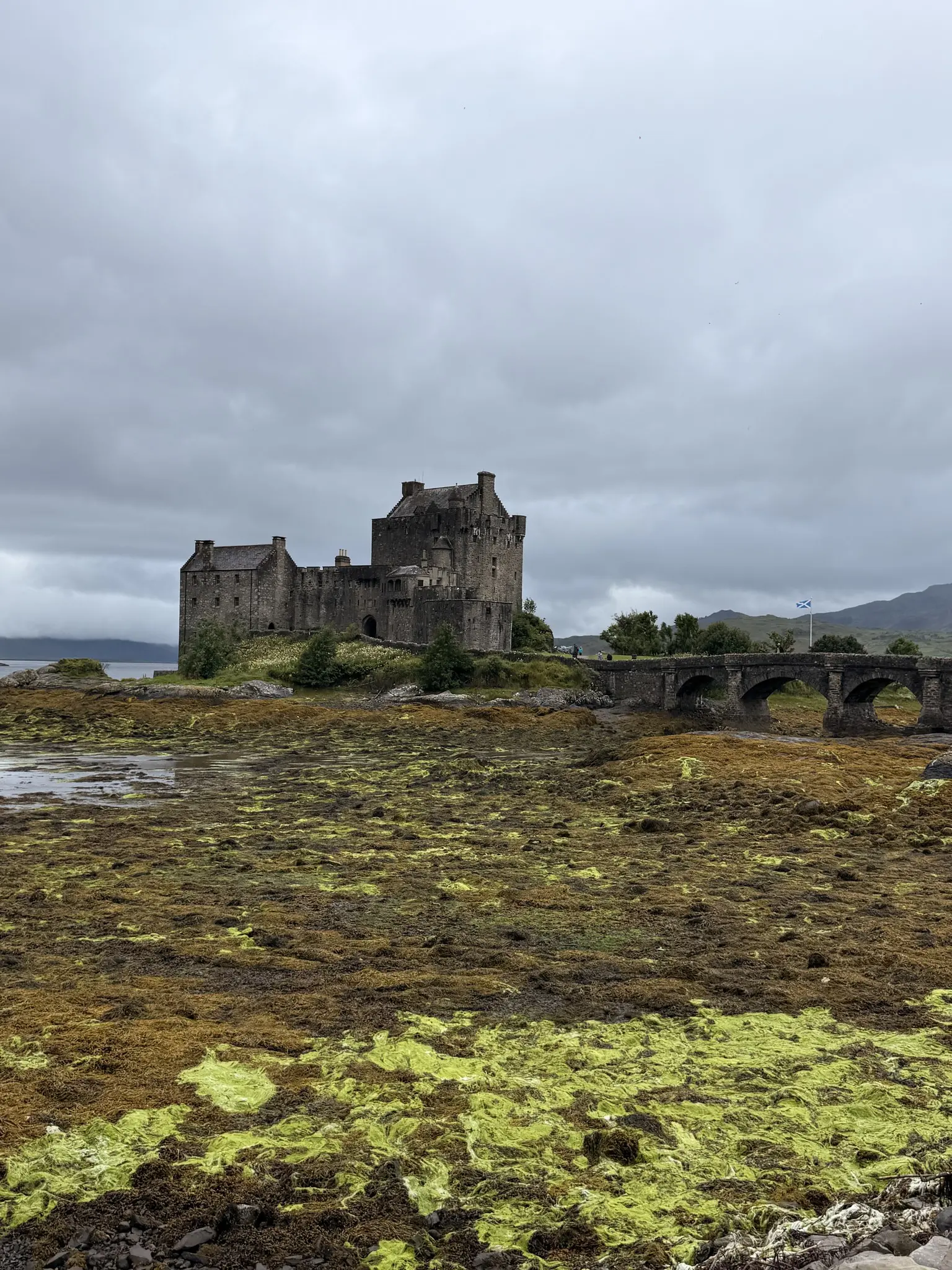 Eilean Donan Castle and bridge on a cloudy day in Scotland