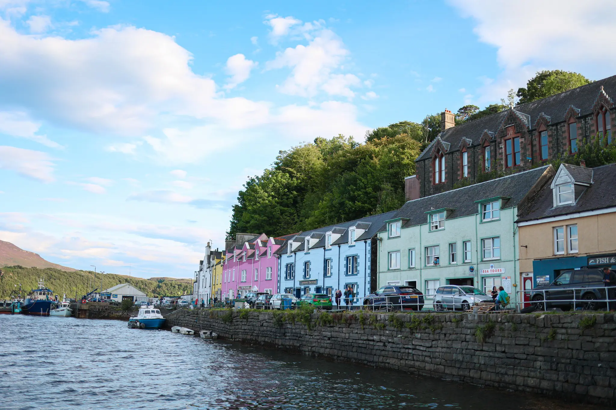 colorful houses along a waterfront in Portree, Isle of Skye