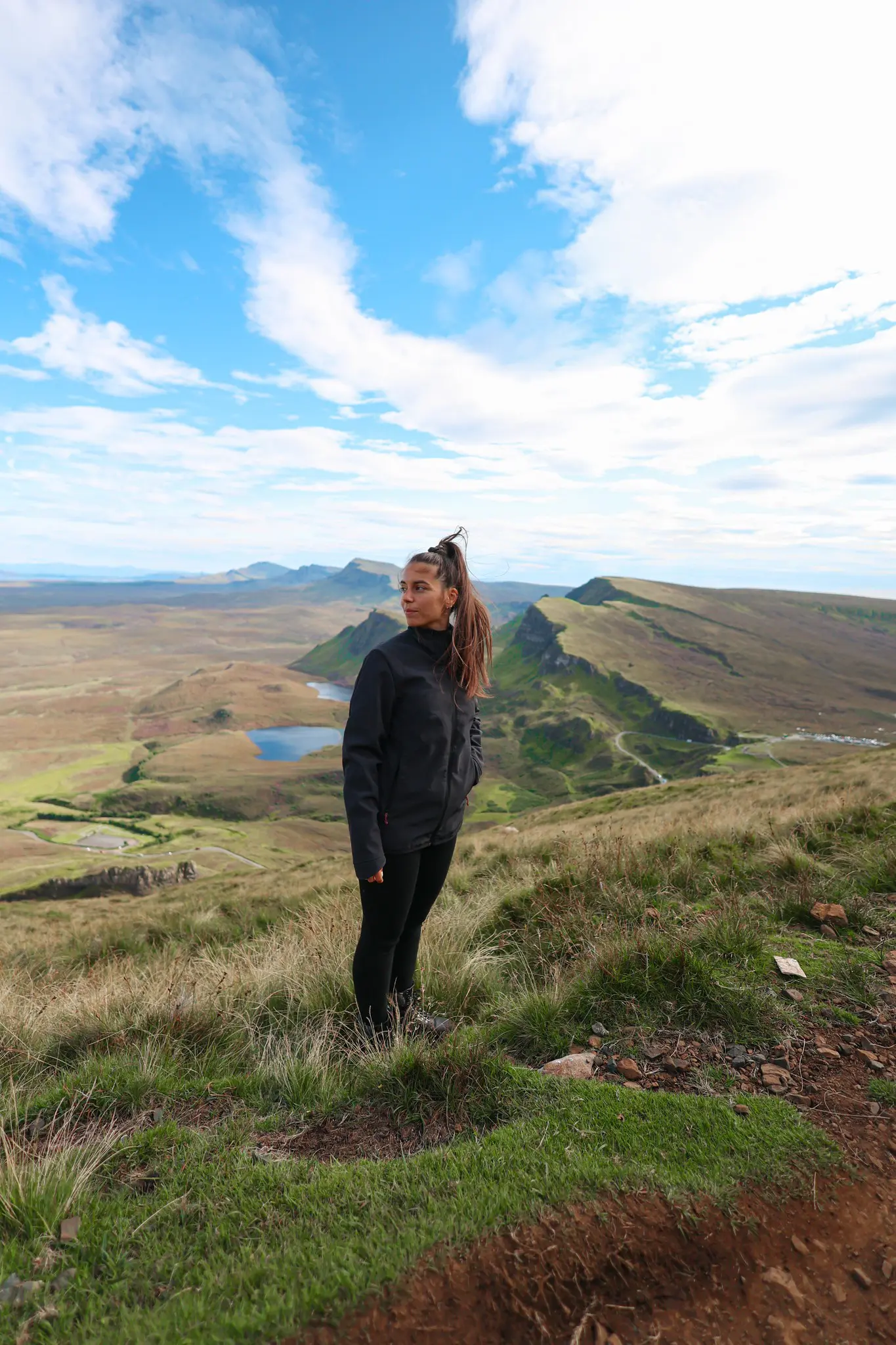 woman hiking in the Scottish Highlands looking at the view