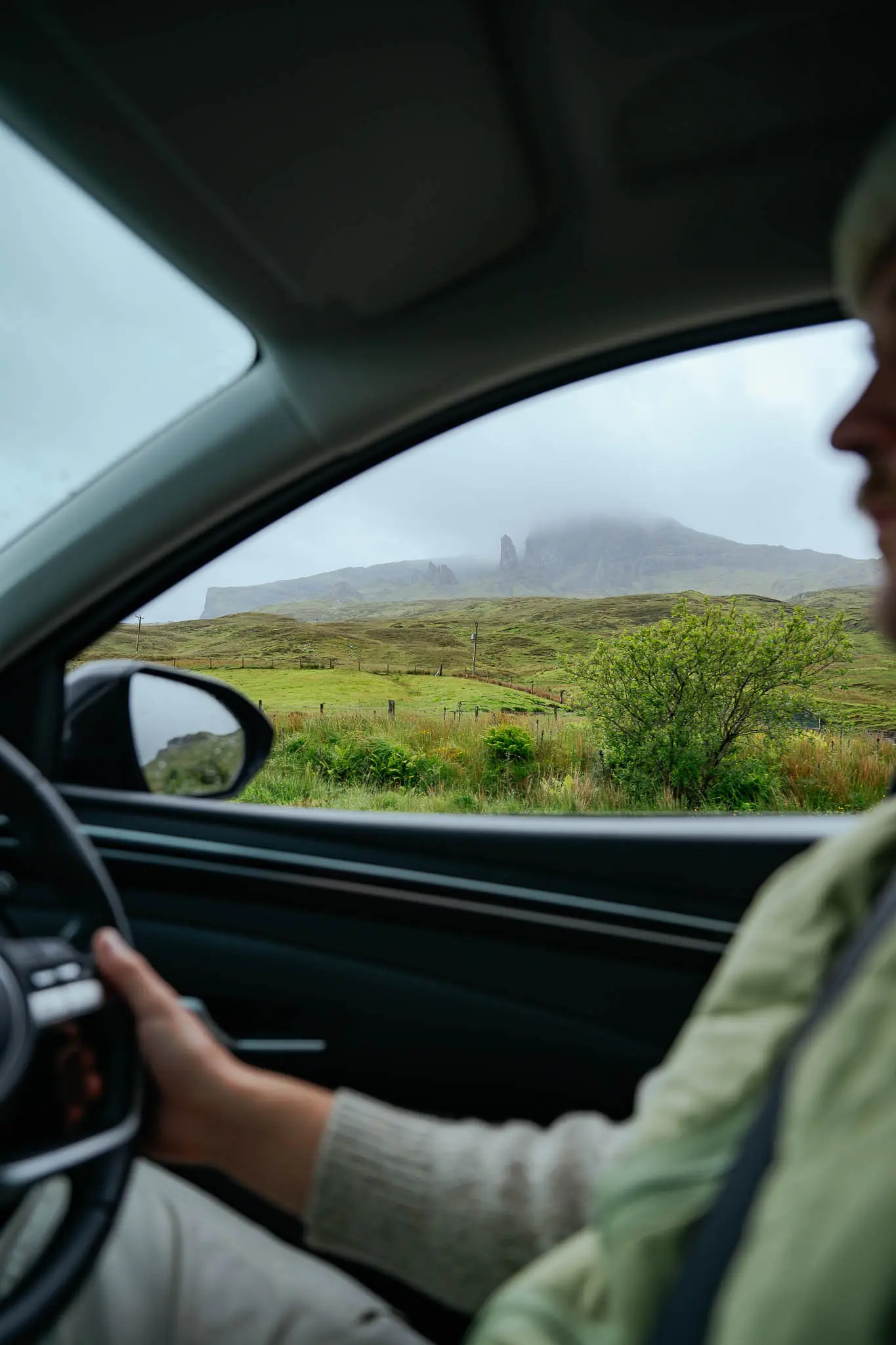 driving through the scottish highlands with old man of storr