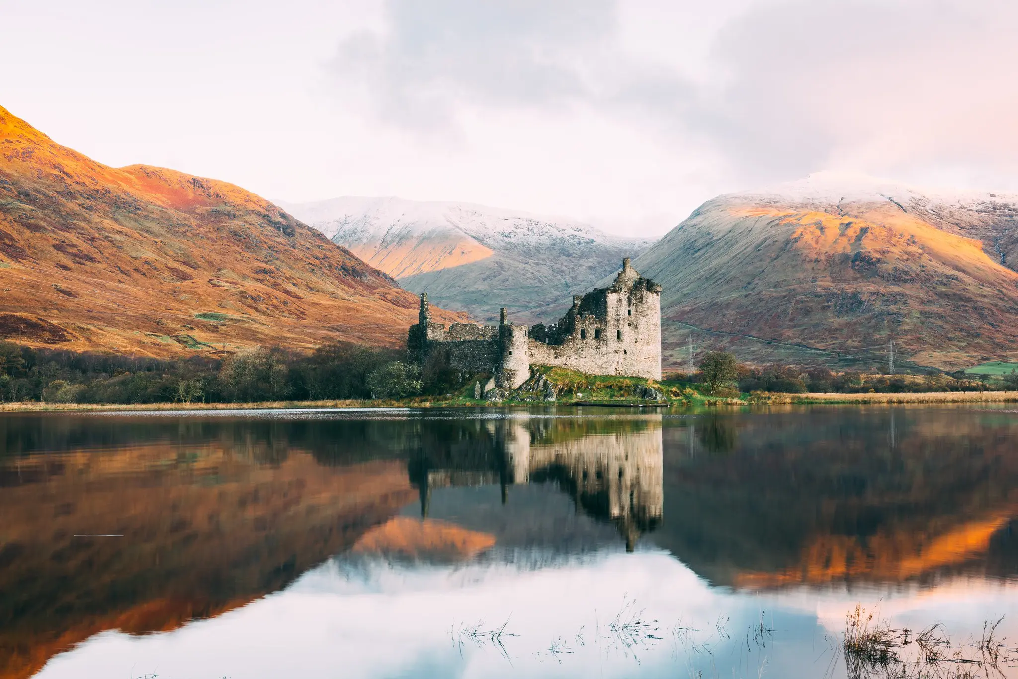 kilchurn castle ruins reflected in loch awe scotland