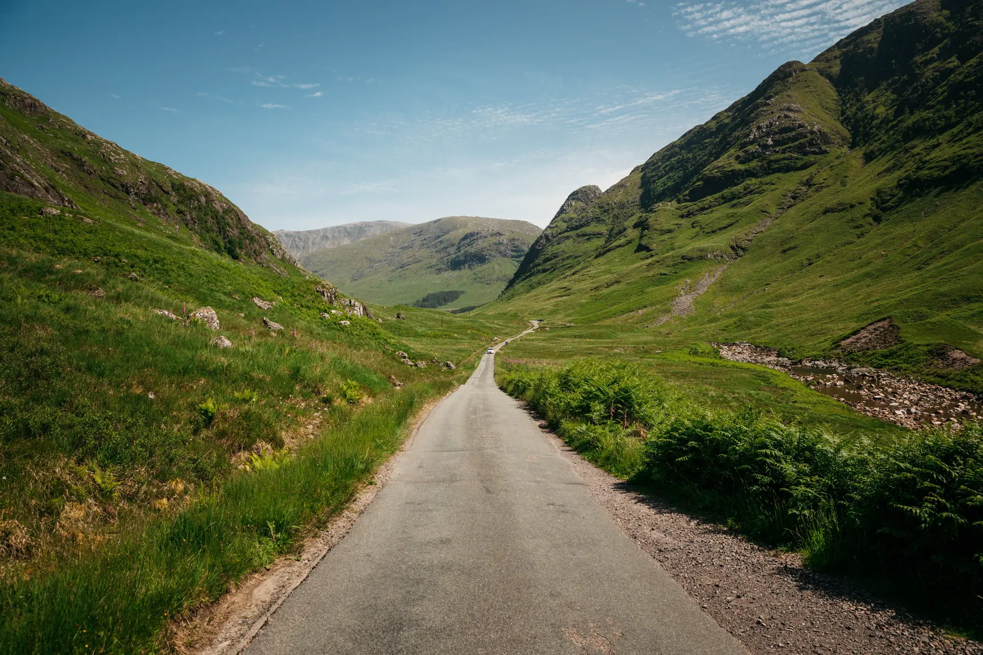winding road through a green valley in Scotland